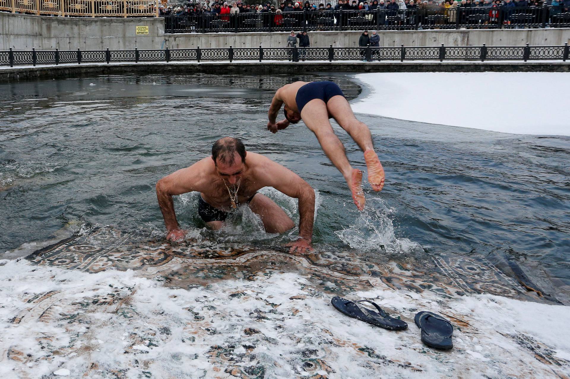 People celebrate the Orthodox Christian feast of Epiphany in the Luhansk region