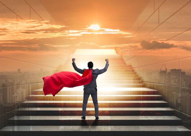 Businessman superhero successful in career ladder concept