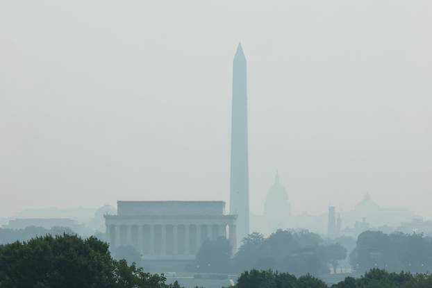 Smoke from Canadian wildfires clouds the National Mall and monuments in Washington