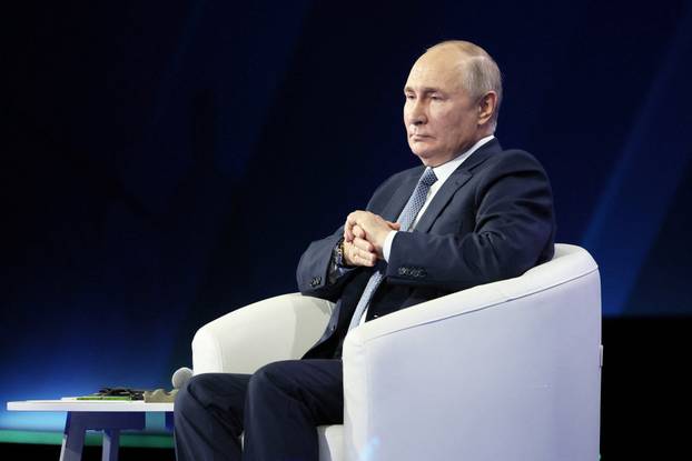 Russian President Vladimir Putin attends a plenary session as part of the 3rd International Olympiad on Financial Security in the Sirius Park of Science and Art in Krasnodar region