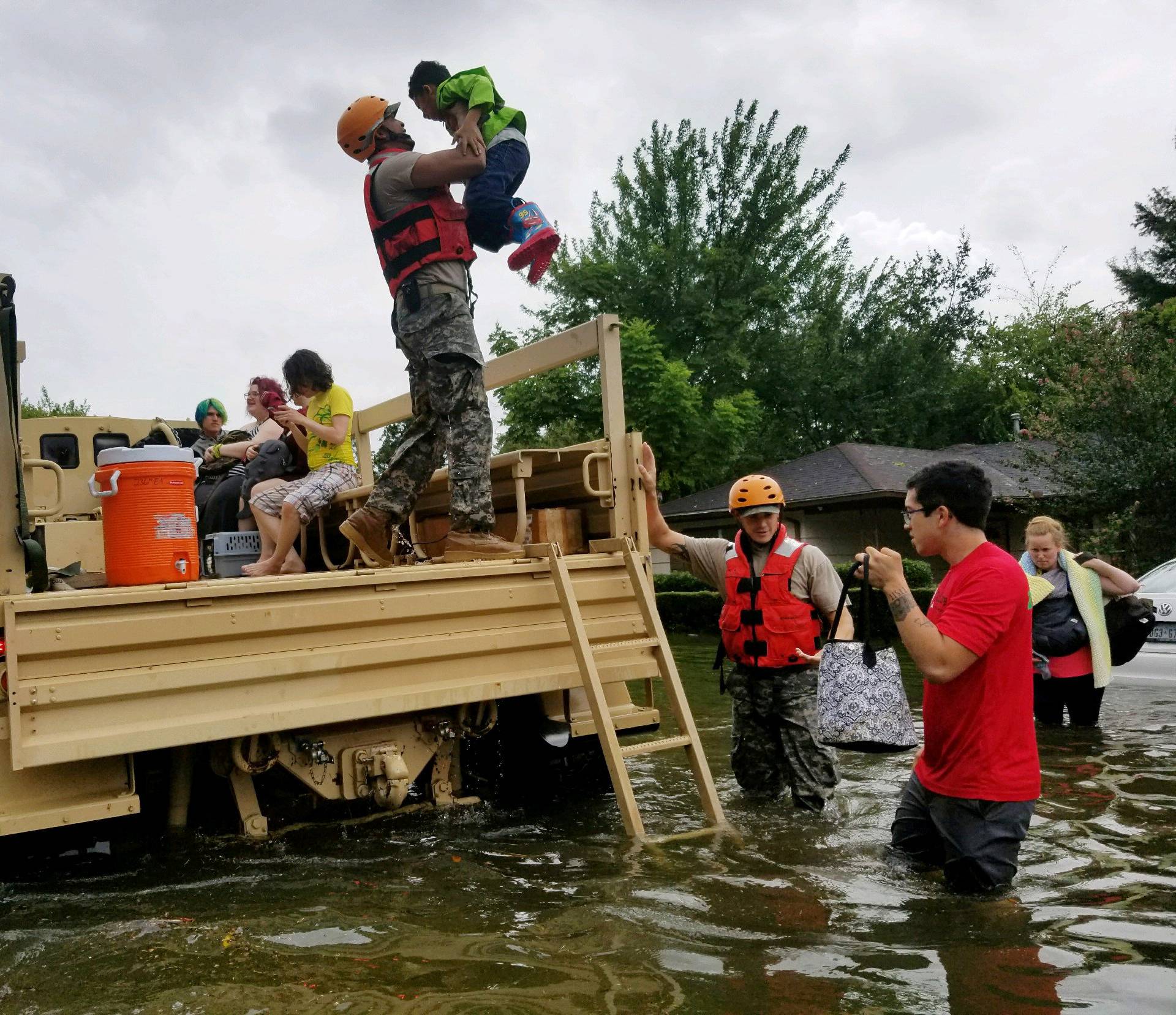 Handout photo of Texas National Guard soldiers aiding residents in heavily flooded areas from the storms of Hurricane Harvey in Houston