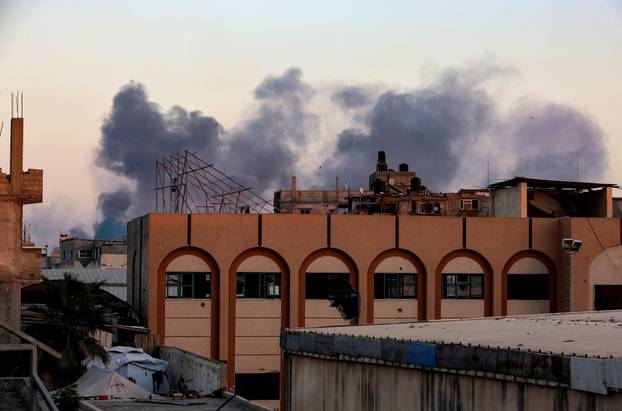 Smoke rises following an Israeli airstrike in Khan Younis