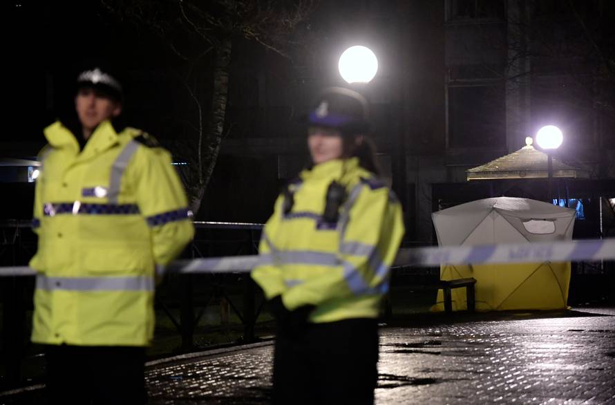 Police officers stand guard beside a cordoned-off area, after former Russian military intelligence officer Sergei Skripal, who was convicted in 2006 of spying for Britain, became critically ill after exposure to an unidentified substance, in Salisbury
