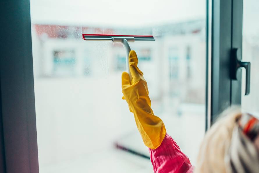 Professional,Cleaning,Service,Worker,Washing,Window,Glass,Using,A,Squeegee