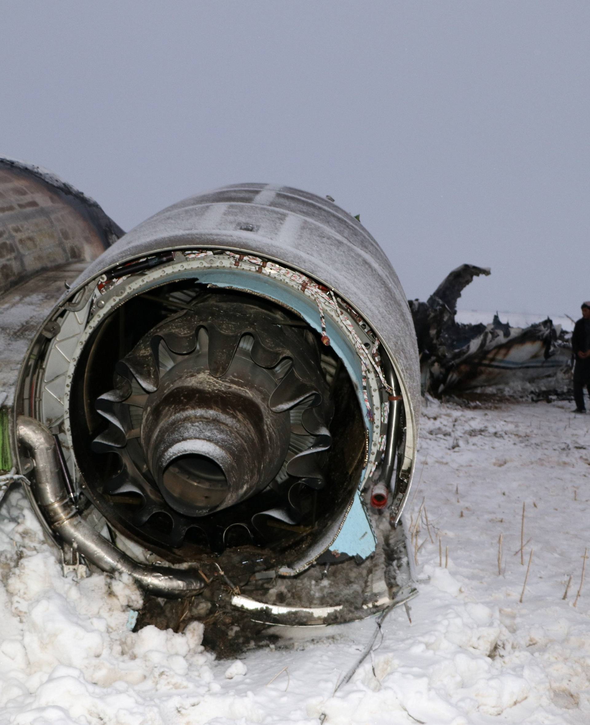 The wreckage of an airplane is seen after a crash in Deh Yak district of Ghazni province, Afghanistan