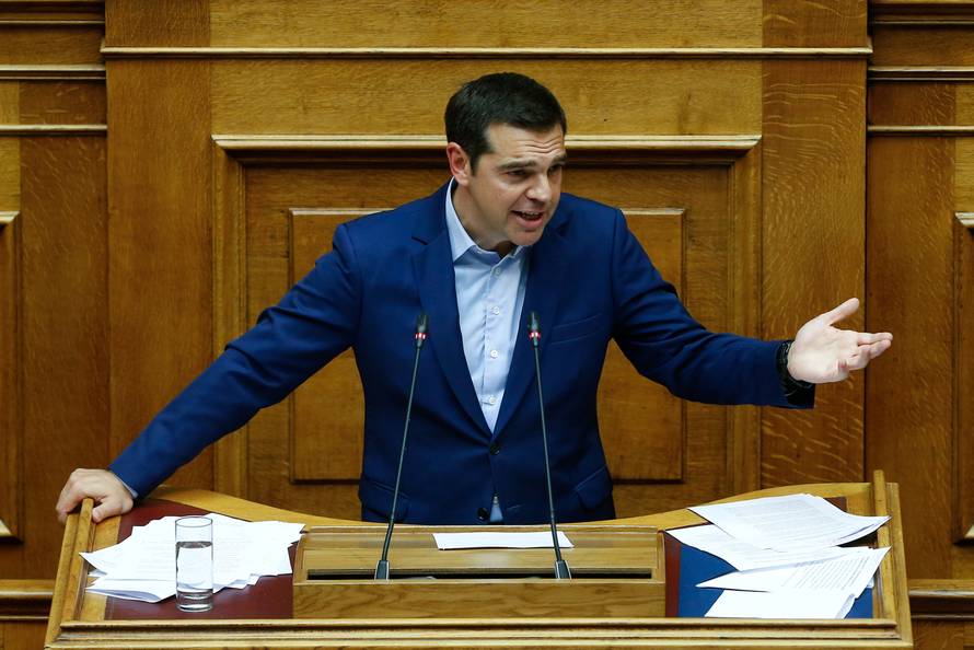 Greek Prime Minister Alexis Tsipras addresses lawmakers during a parliamentary session before a vote following a motion of no confidence by the main opposition in dispute over a deal on neighbouring Macedonia's name, in Athens