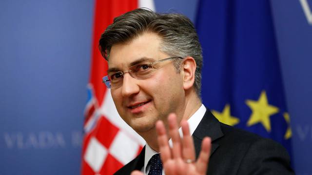 Croatia's Prime Minister Andrej Plenkovic gestures in a government building in Zagreb