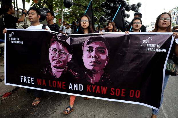 People march to show solidarity for jailed Reuters journalists Wa Lone and Kyaw Soe Oo in Yangon