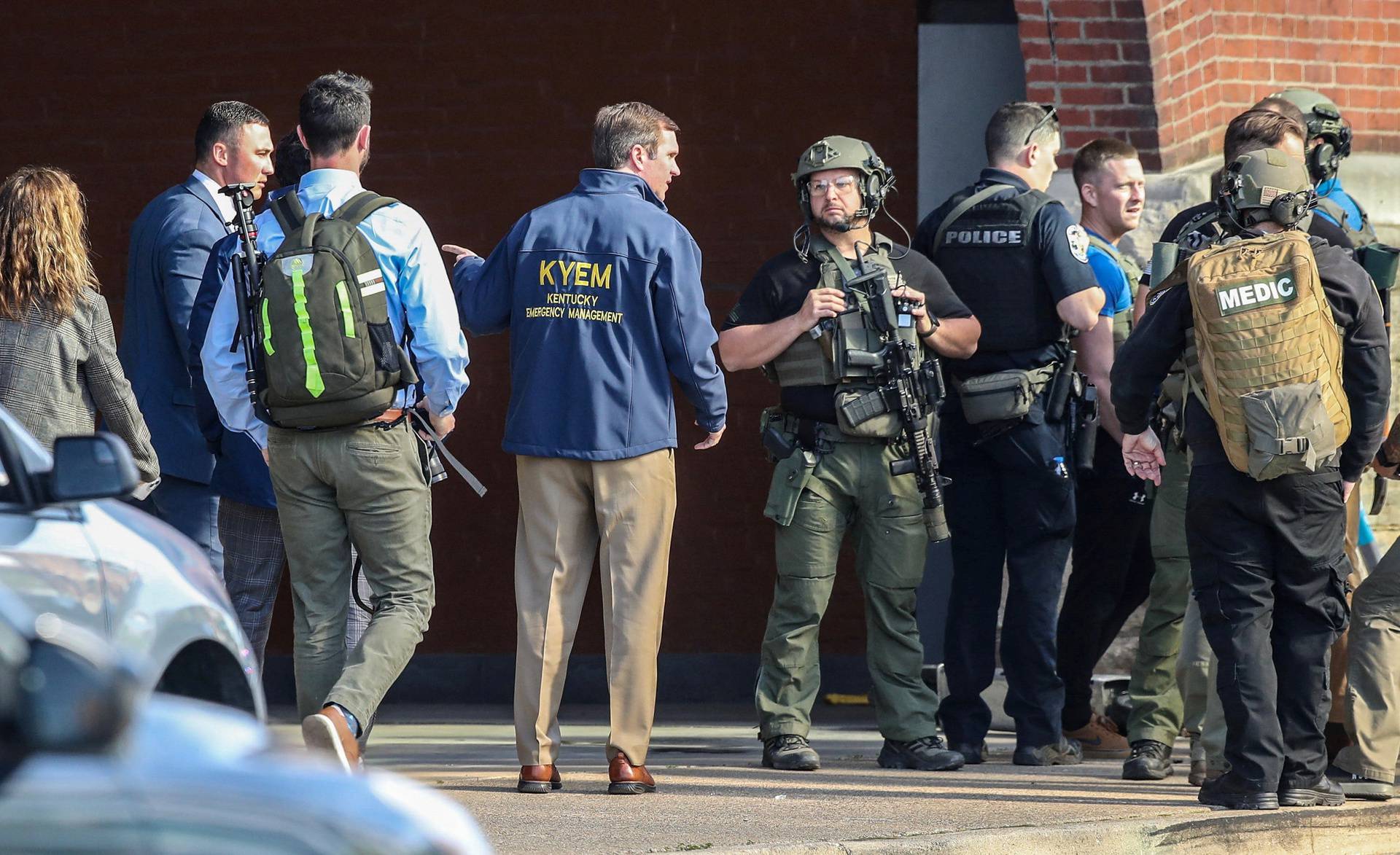 Police deploy at the scene of a mass shooting near Slugger Field baseball stadium in downtown Louisville