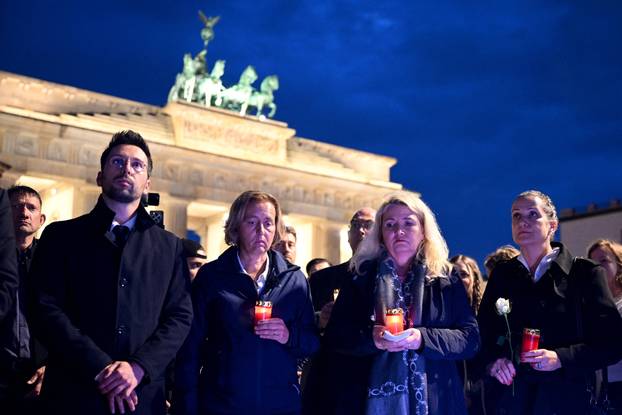 People gather to commemorate of Charlie Kirk in front of the Embassy of the United States in Berlin