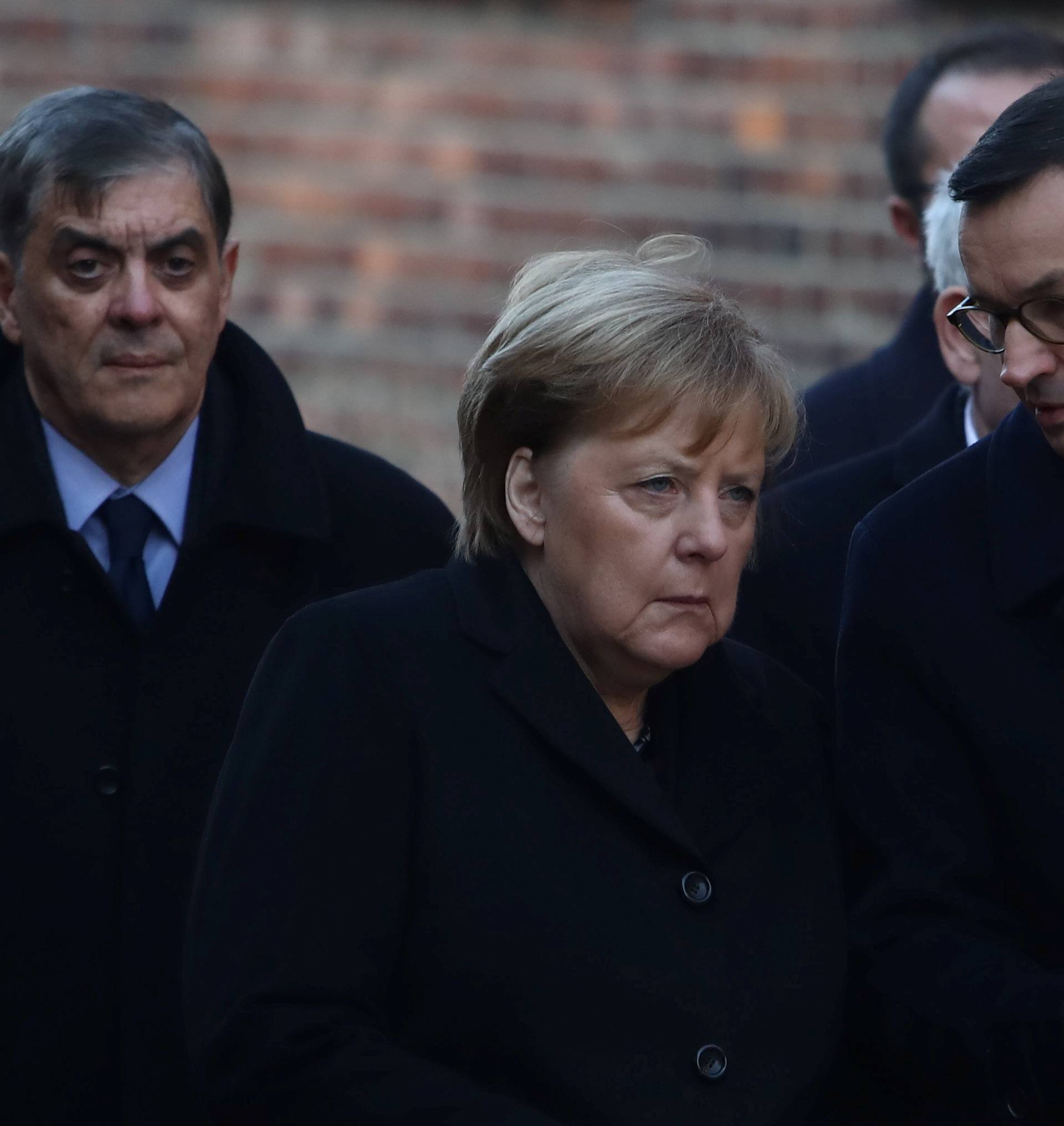 Polish Prime Minister Morawiecki and German Chancellor Merkel visit the Auschwitz-Birkenau memorial in Oswiecim