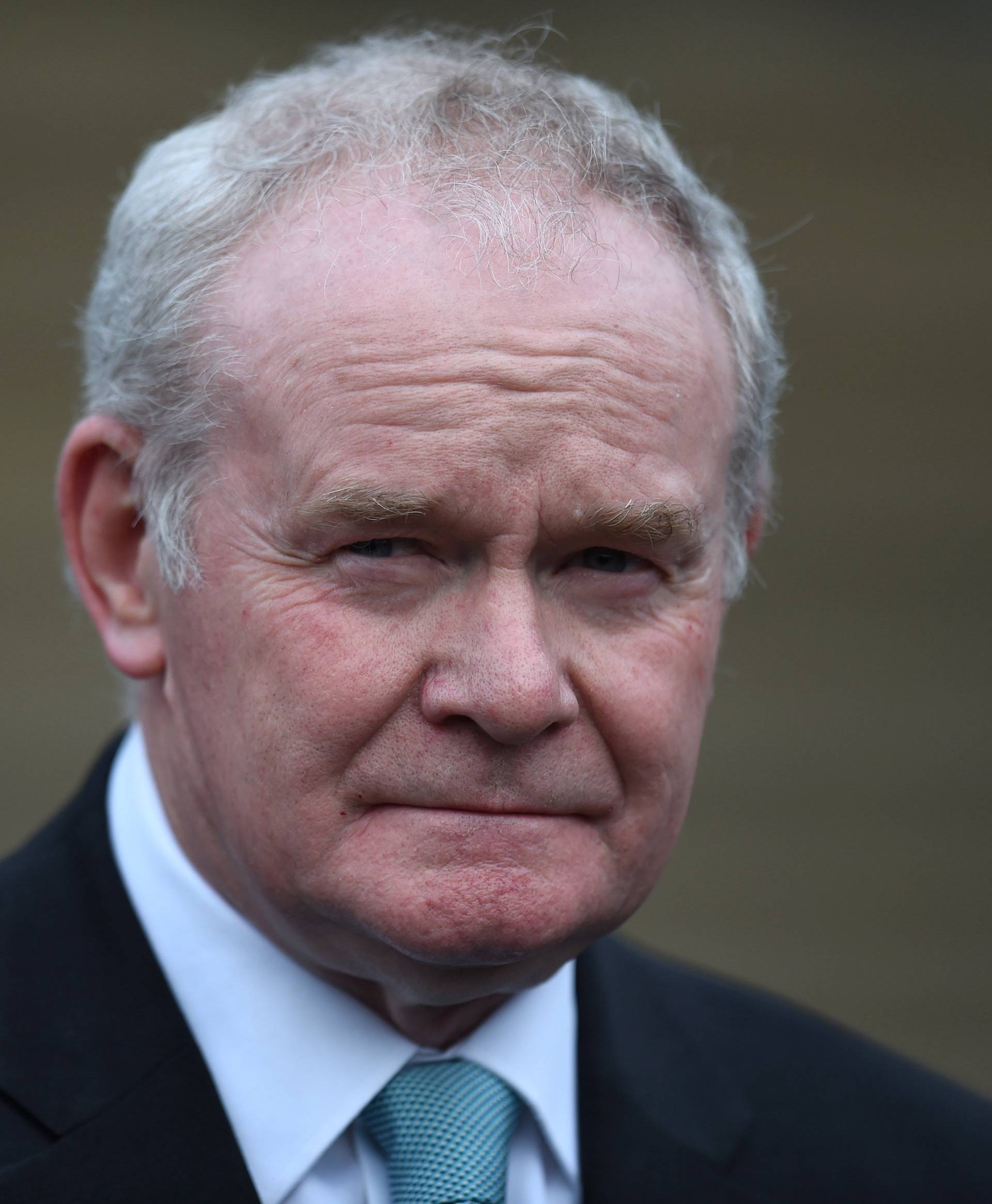 FILE PHOTO: Northern Ireland's Deputy First Minister Martin McGuinness pauses before speaking to media at Stormont Castle as he arrives to greet Colombia's President Juan Manuel Santos who is on a state visit to Belfast, Northern Ireland