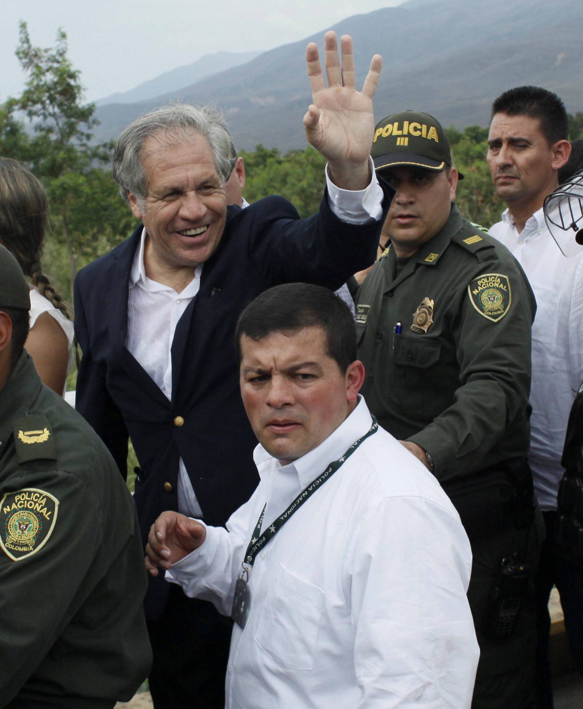 OAS Secretary General Almagro waves to people during his visit to the Colombia-Venezuela border at the Simon Bolivar international bridge in Cucuta