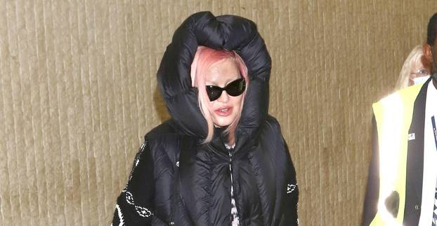 Madonna takes airport style to the next level in chunky Balenciaga shoes