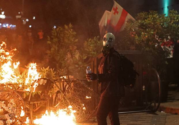Opposition supporters hold a rally on the day of local elections in Tbilisi