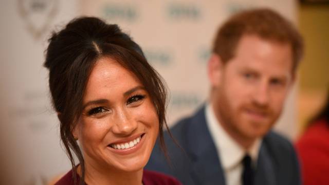 FILE PHOTO: FILE PHOTO: Britain's Meghan, the Duchess of Sussex, and Prince Harry, Duke of Sussex, attend a roundtable discussion on gender equality with The Queen's Commonwealth Trust (QCT) and One Young World at Windsor Castle