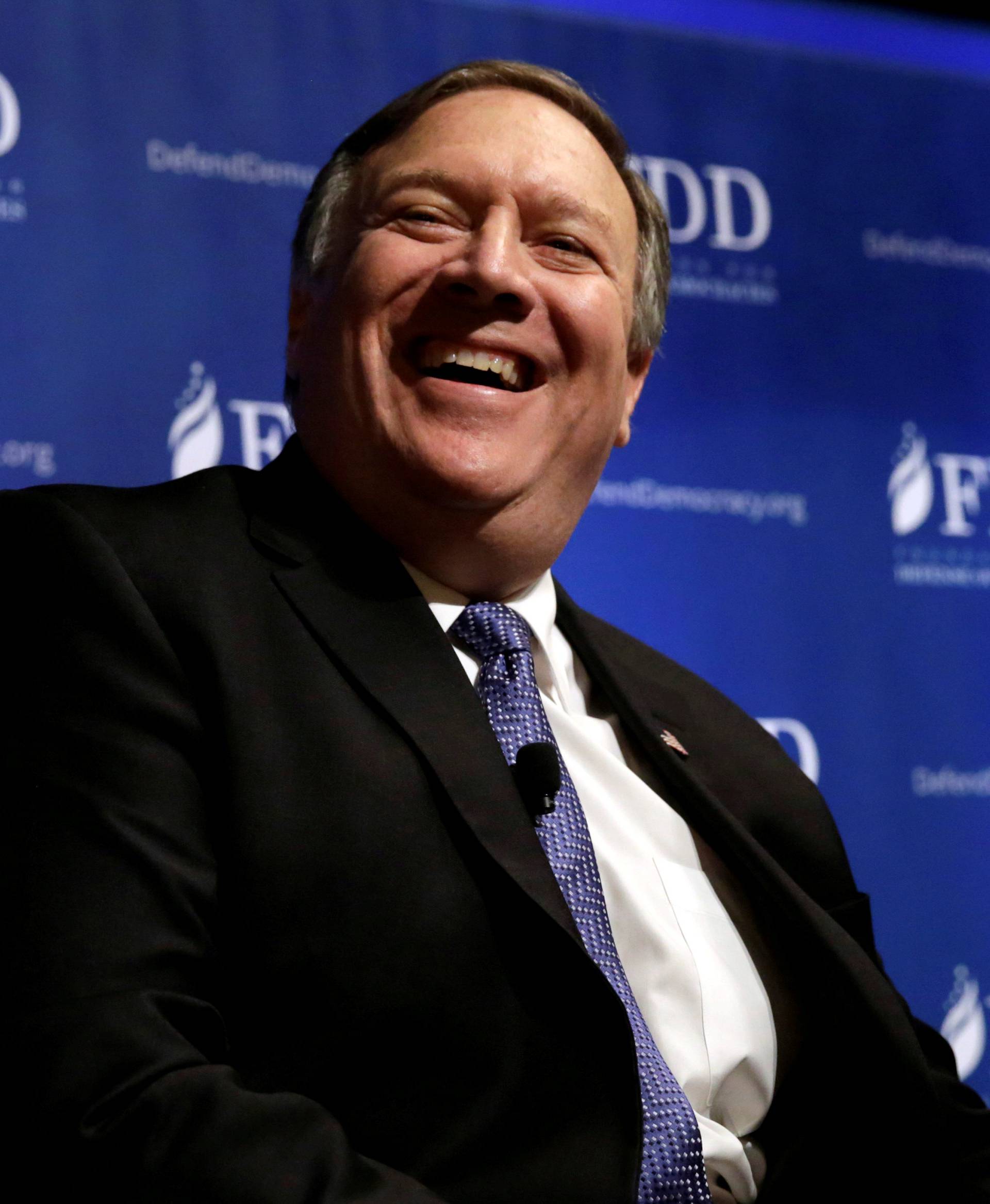FILE PHOTO: CIA Director Mike Pompeo laughs during the FDD National Security Summit in Washington