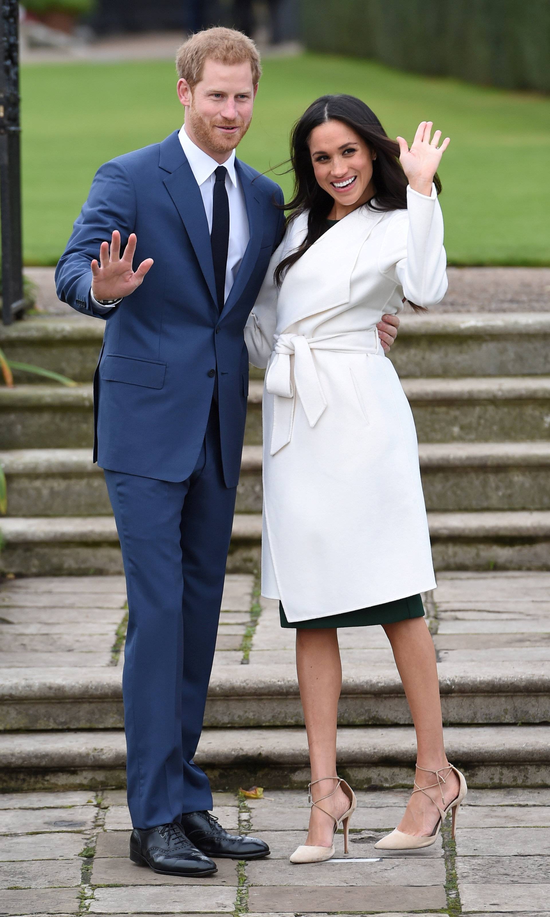FILE PHOTO: Britain's Prince Harry poses with Meghan Markle in the Sunken Garden of Kensington Palace, London
