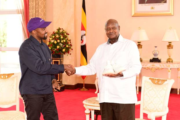 Rapper Kanye West (L) meets Uganda
