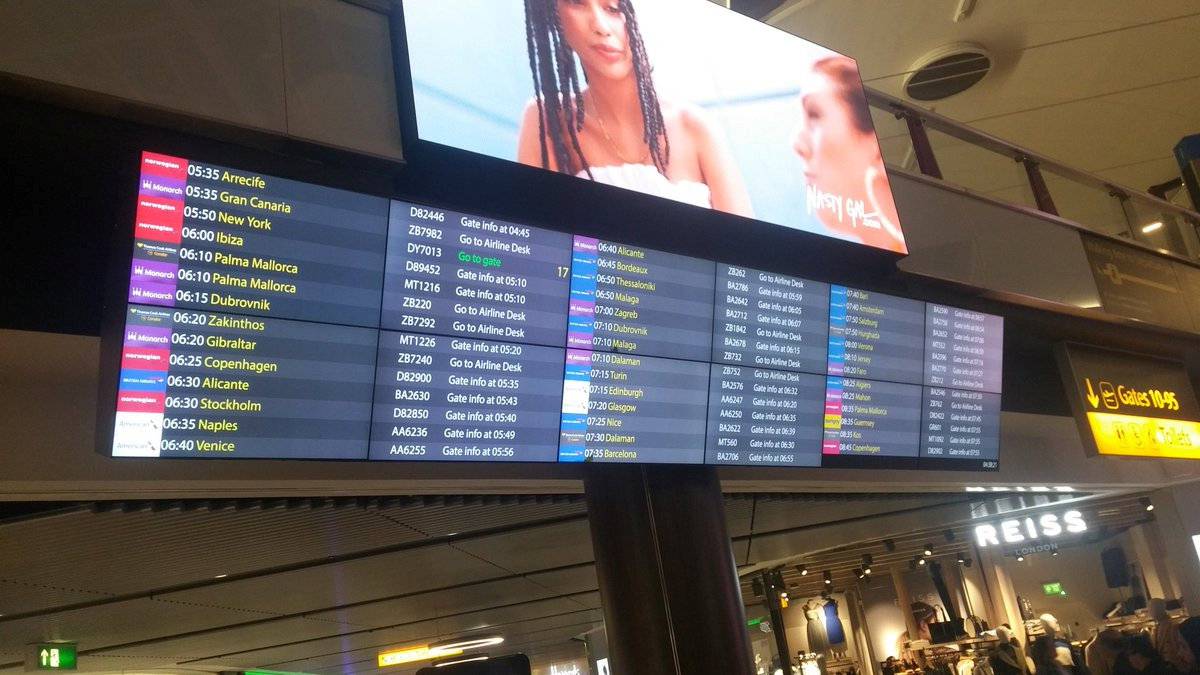 A flight information display board is pictured at Gatwick Airport