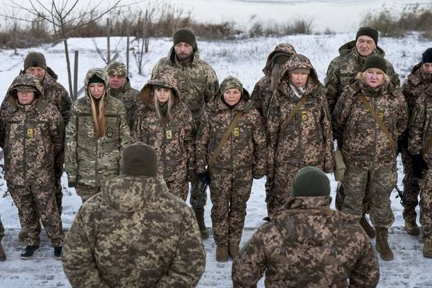 Witches of Bucha, a group of female volunteer soldiers, undergo tactical shooting training in Kyiv - 08 Feb 2025