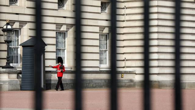 A guardsman is seen on duty in the grounds of Buckingham Palace in London