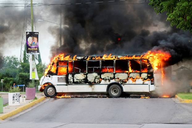 FILE PHOTO: Cartel gunmen torch bus to block road amid clashes over Ovidio Guzman’s arrest in Culiacan