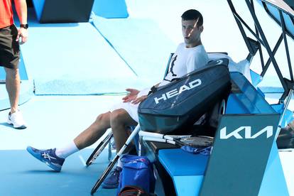 Novak Djokovic practices on court ahead of 2022 Australian Open