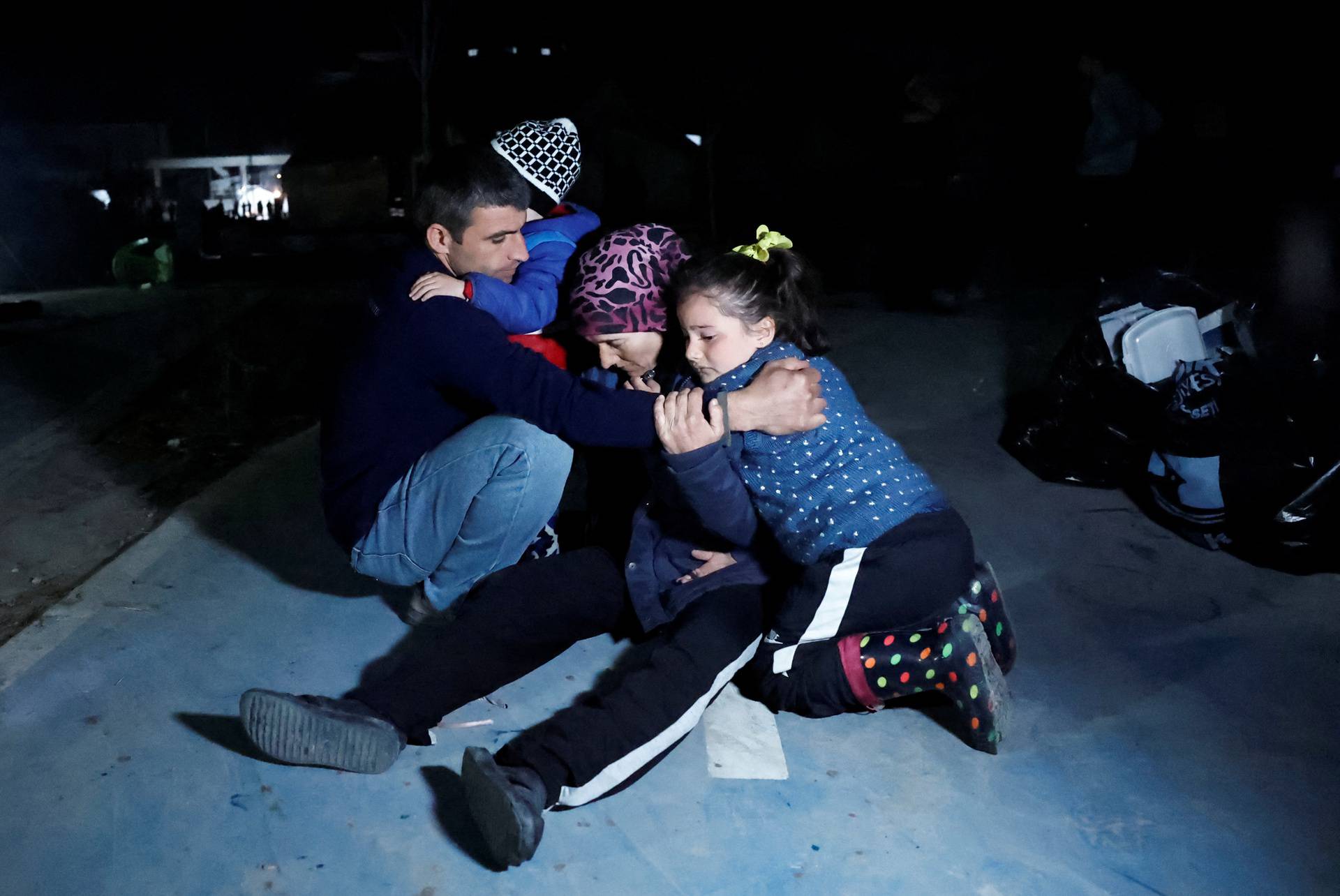 People react after a quake in Antakya in Hatay province, Turkey