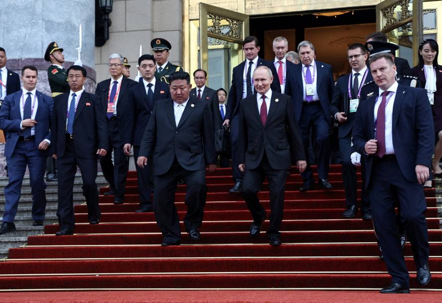 Russian President Vladimir Putin meets with North Korean leader Kim Jong Un in Beijing