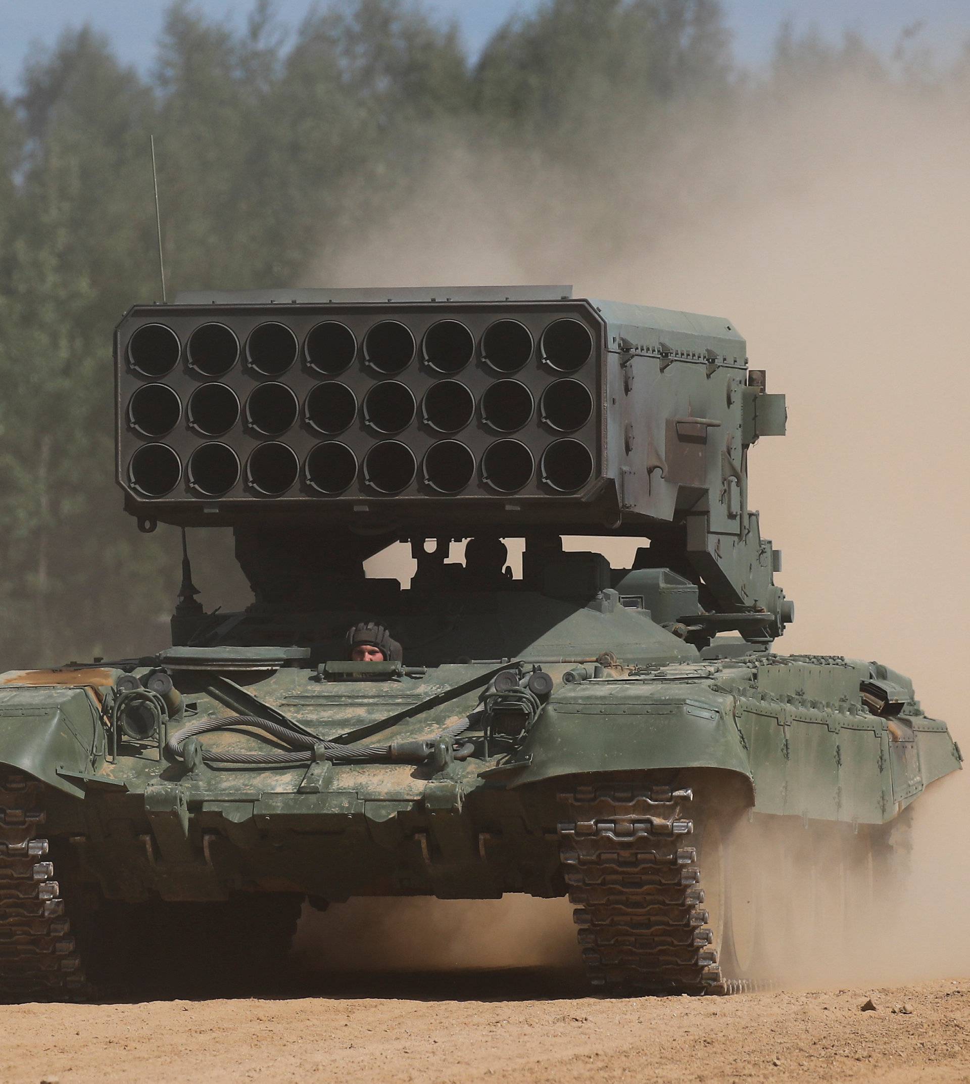 A Russian TOS-1A Solntsepek multiple rocket launcher drives during the annual international military-technical forum "ARMY" in Alabino