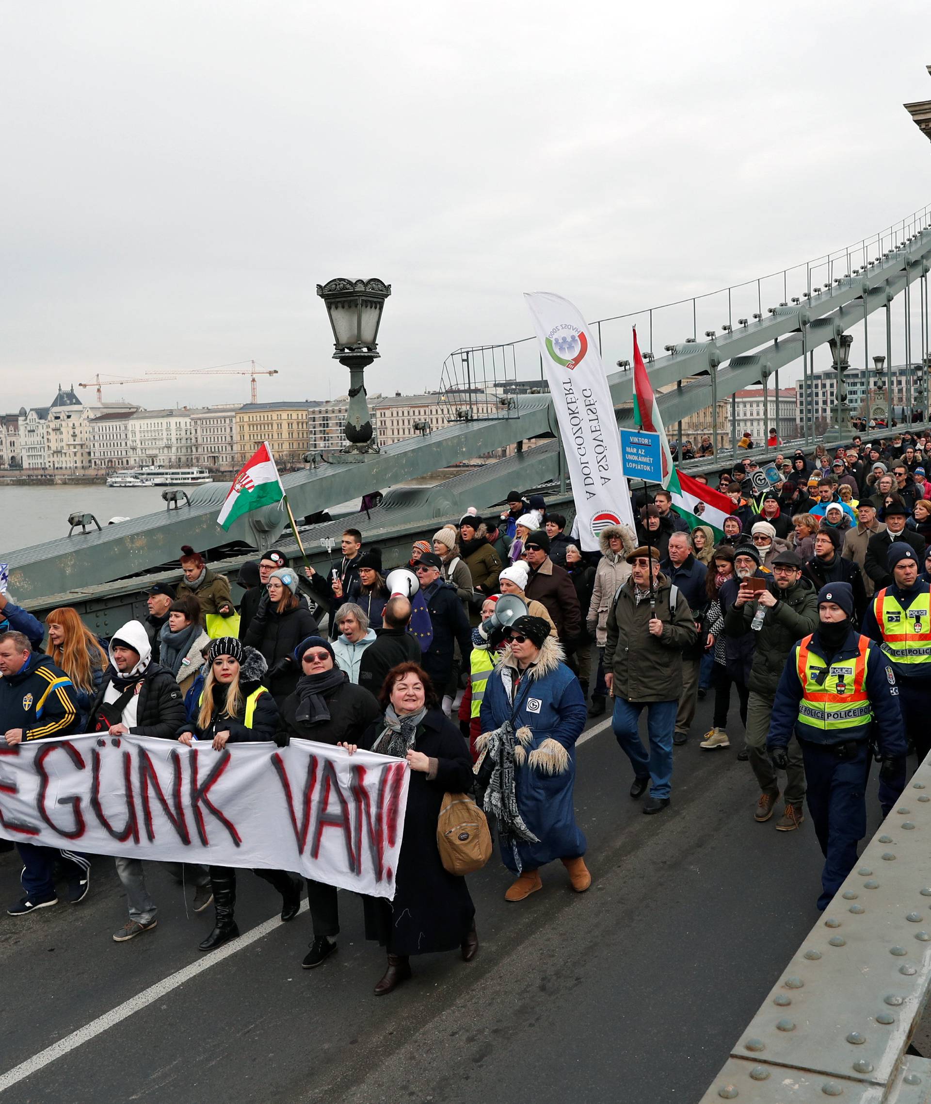 People take part in a protest against a proposed new labor law, billed as the "slave law", in Budapest
