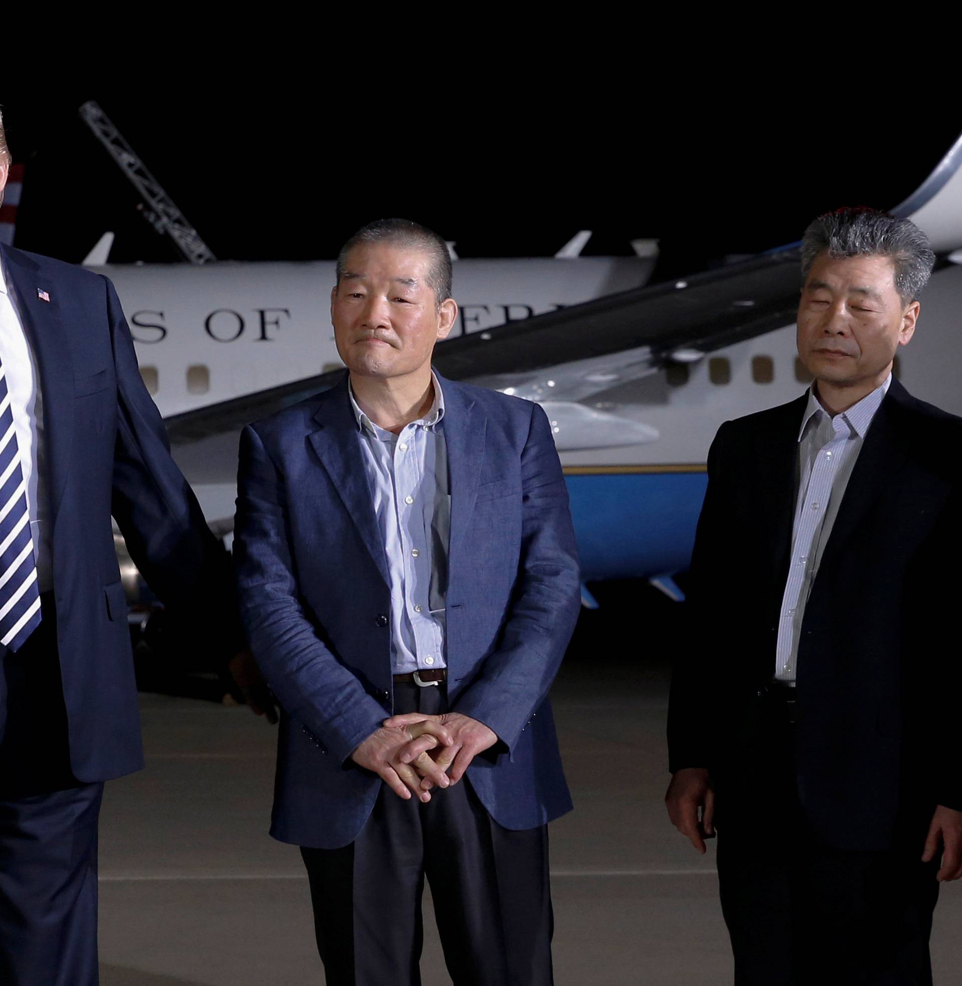 U.S.President Donald Trump speaks to the media next to the Americans released from detention in North Korea, Tony Kim, Kim Hak-song and Kim Dong-chul, upon their arrival at Joint Base Andrews