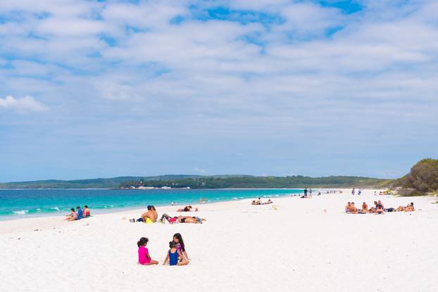 People enjoying the sunny weather at Hyams Beach, NSW, Australia