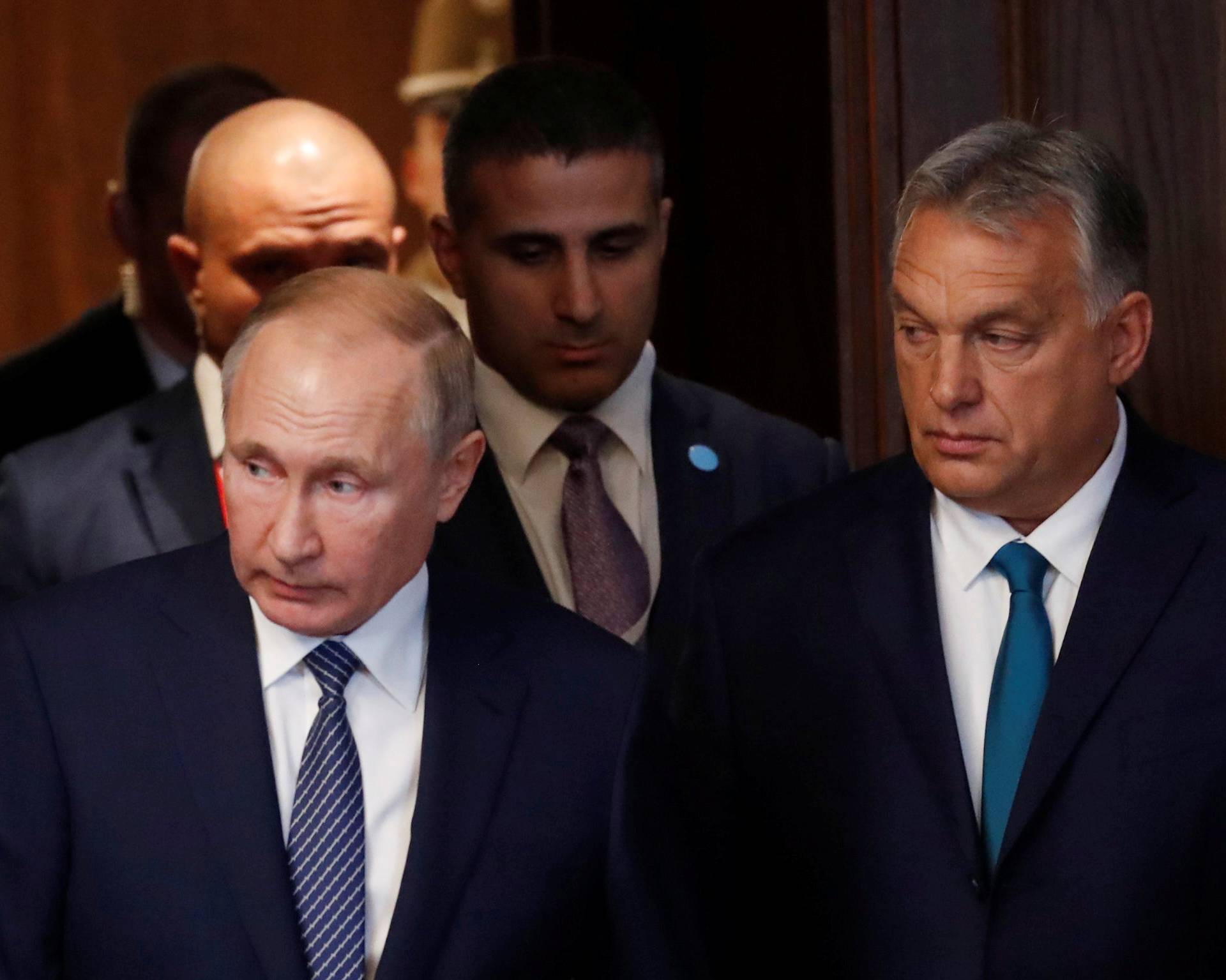 Hungarian Prime Minister Viktor Orban and Russian President Vladimir Putin arrive to attend a signing ceremony following their talks in Budapest