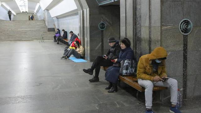 People gather in a metro station in Kharkiv