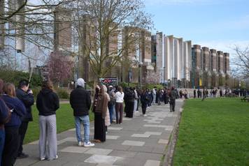 Students queuing for antibiotics outside a building at the University of Kent in Canterbury. The university have confirmed that a student was one of two people who have died as a result of meningitis in the area. The UK Health Security Agency (UKHSA) said