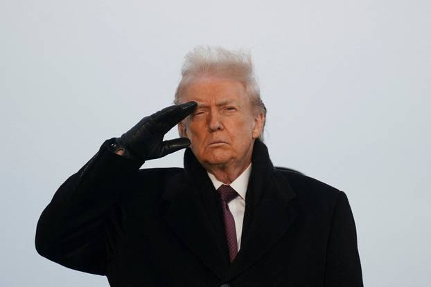 U.S. President Donald Trump participates in a dignified transfer of the remains of two Iowa National Guard members, in Dover
