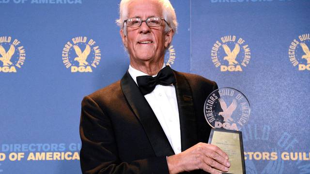 FFILE PHOTO: Aldrich Award recipient Michael Apted poses at the 65th annual Directors Guild of America Awards in Los Angeles, California