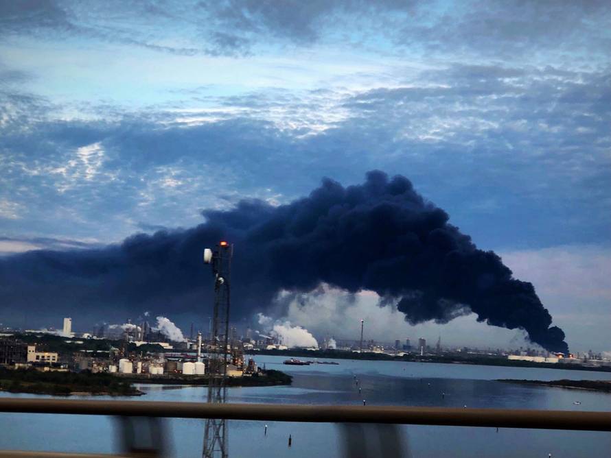 Handout photo of smoke rising from a fire burning at the Intercontinental Terminals Company in Deer Park, east of Houston