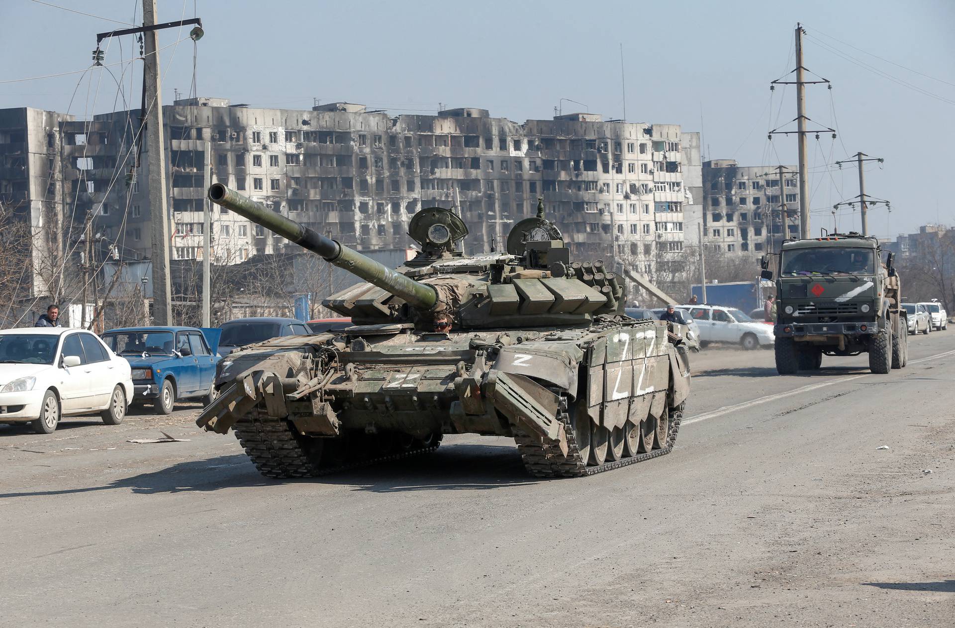 A tank of pro-Russian troops drives in a street in Mariupol