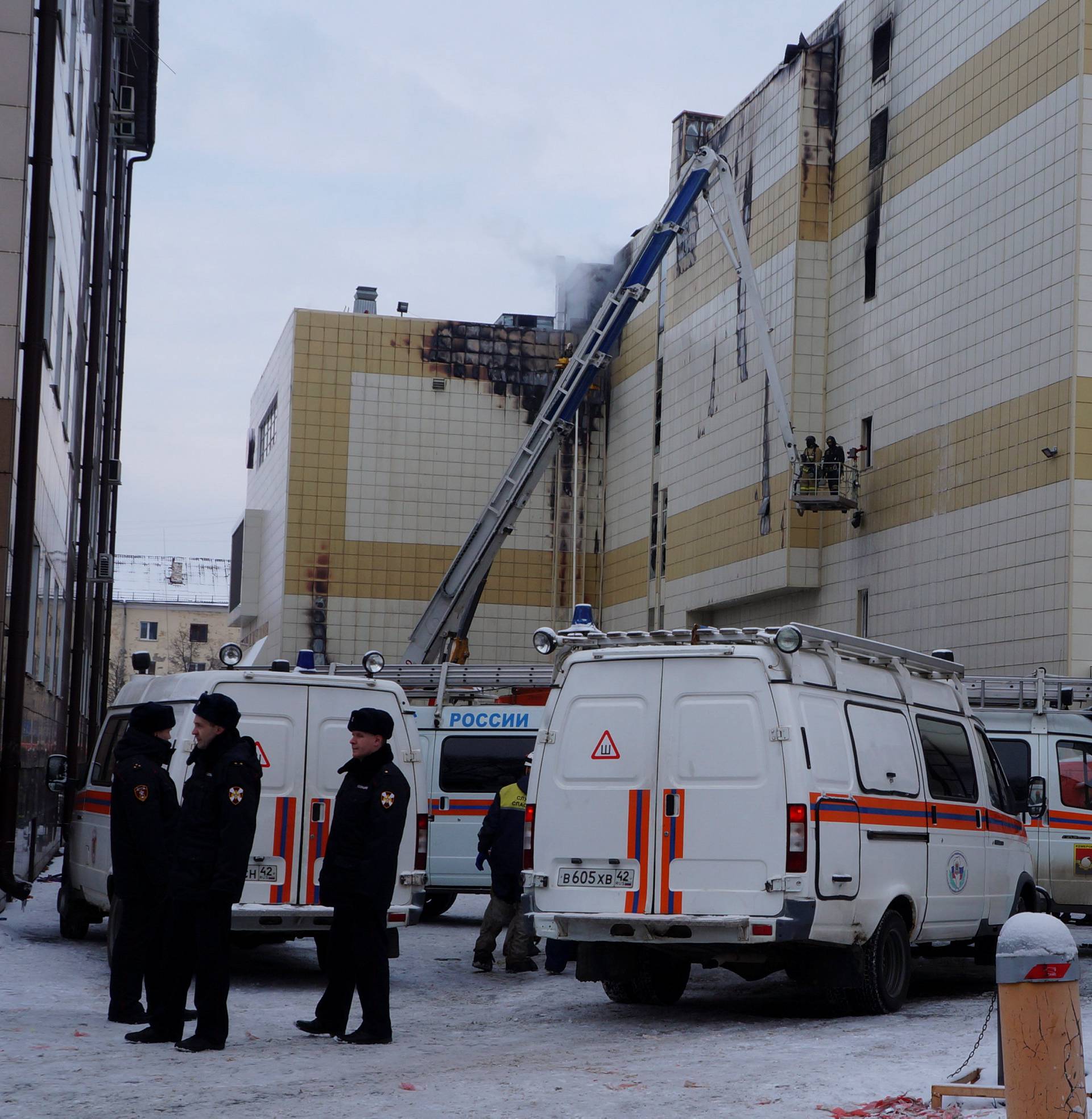 Members of the Emergency Situations Ministry work to extinguish a fire in a shopping mall in Kemerovo