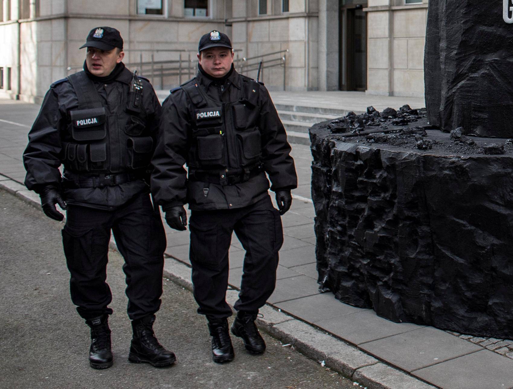 Greenpeace activists demonstrate on a street following the decision of the CJEU, in Warsaw