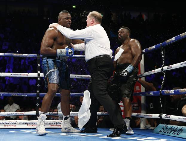 Dillian Whyte (L) and Dereck Chisora are seperated at the end of a round