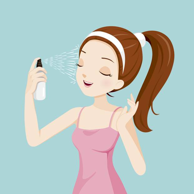 Girl Spraying Mineral Water On Her Face