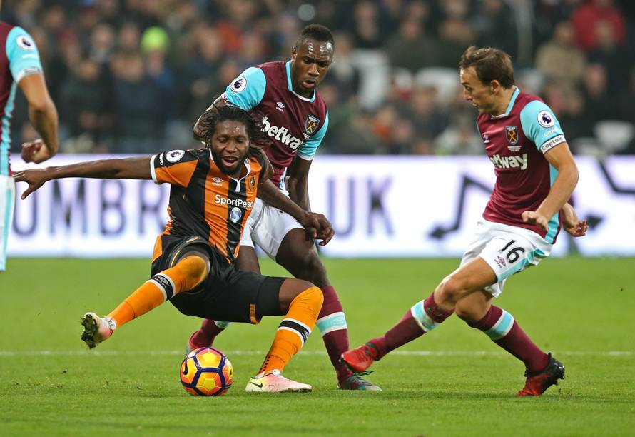 West Ham United's Mark Noble and Michail Antonio in action with Hull City's Dieumerci Mbokani