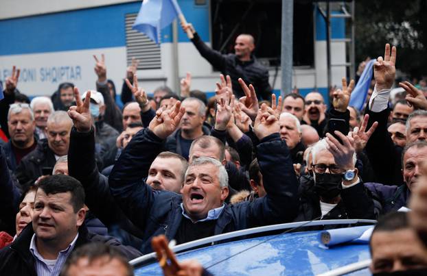 Protesters attack the headquarters of the Democratic Party in Tirana