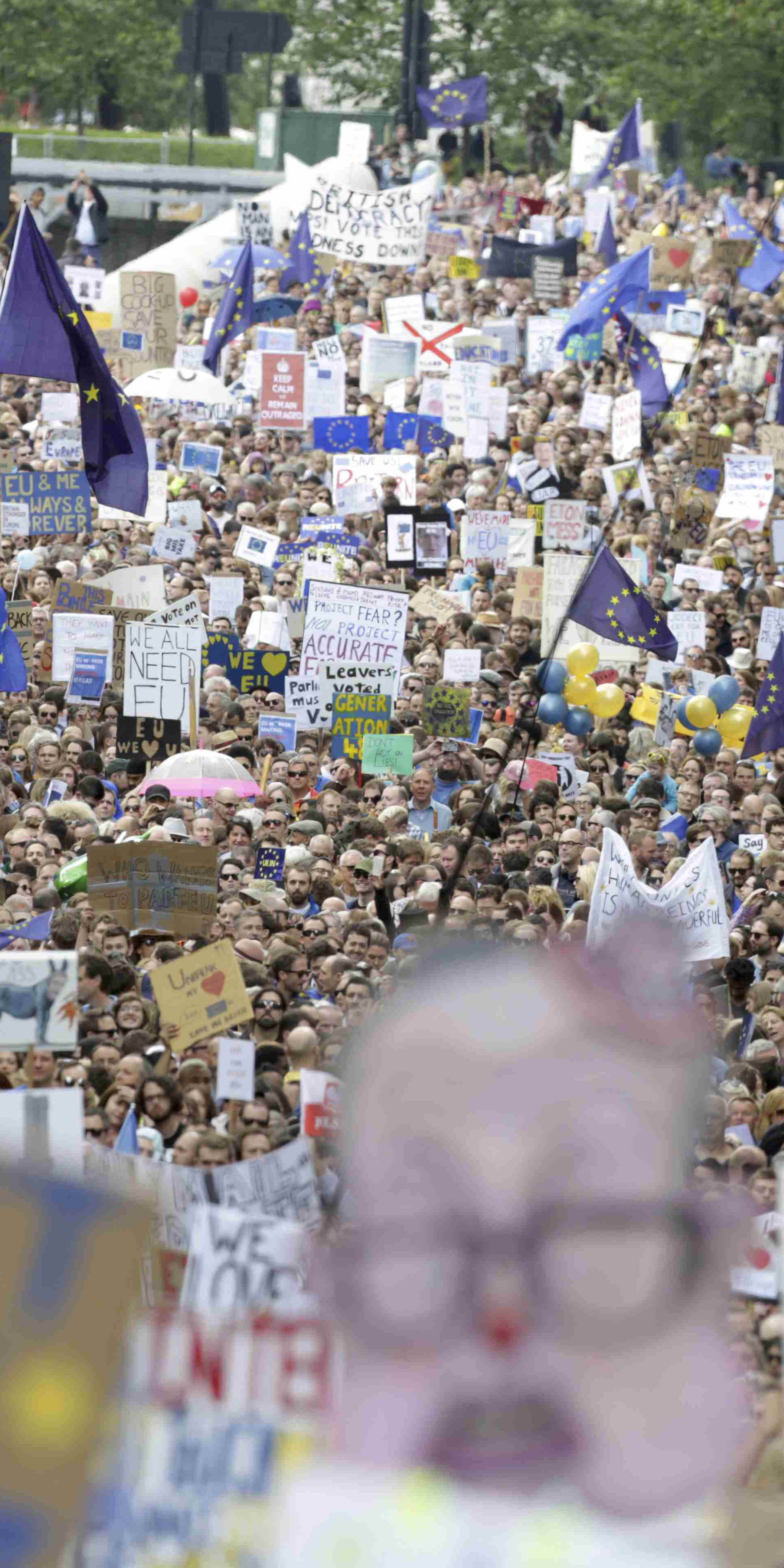 People hold banners during a demonstration against Britain's decision to leave the European Union, in central London
