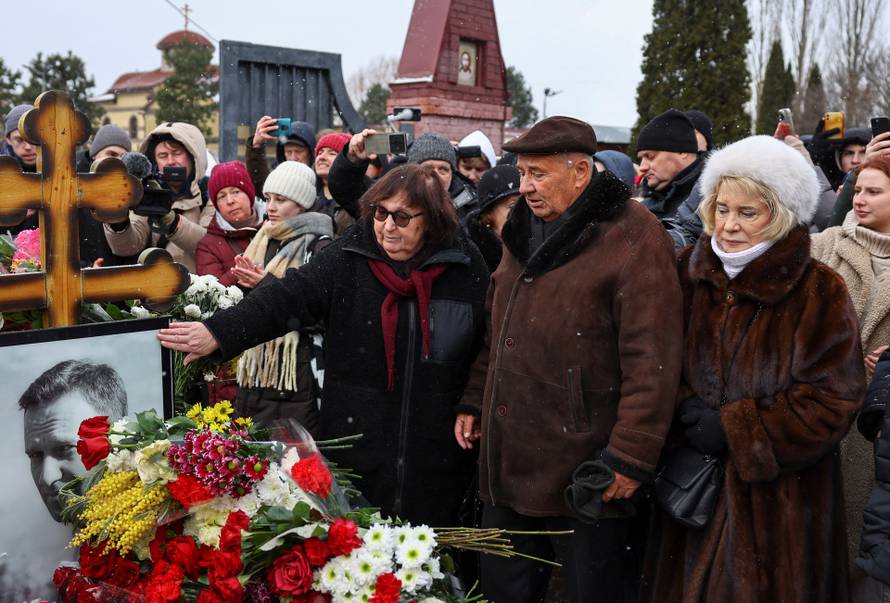 People mark first anniversary of Russian opposition leader Navalny's death at Moscow cemetery