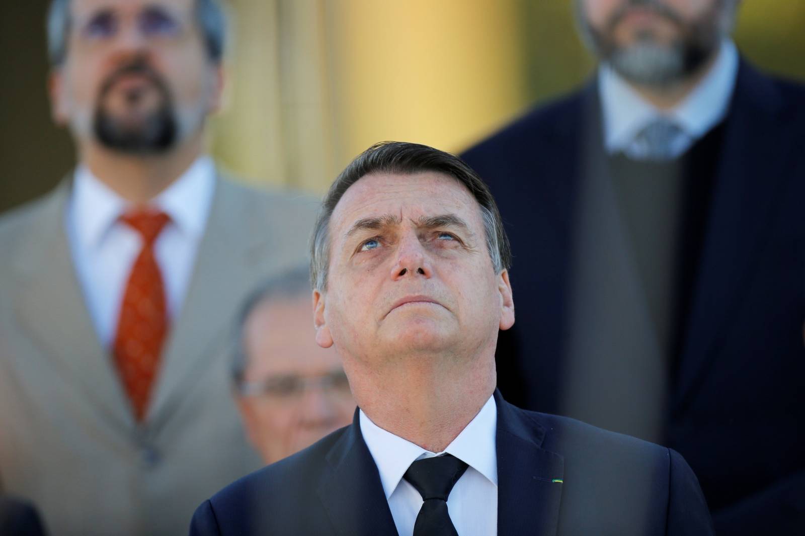 Brazil's President Bolsonaro attends a ceremony of hoisting the national flag in front the Planalto Palace in Brasilia